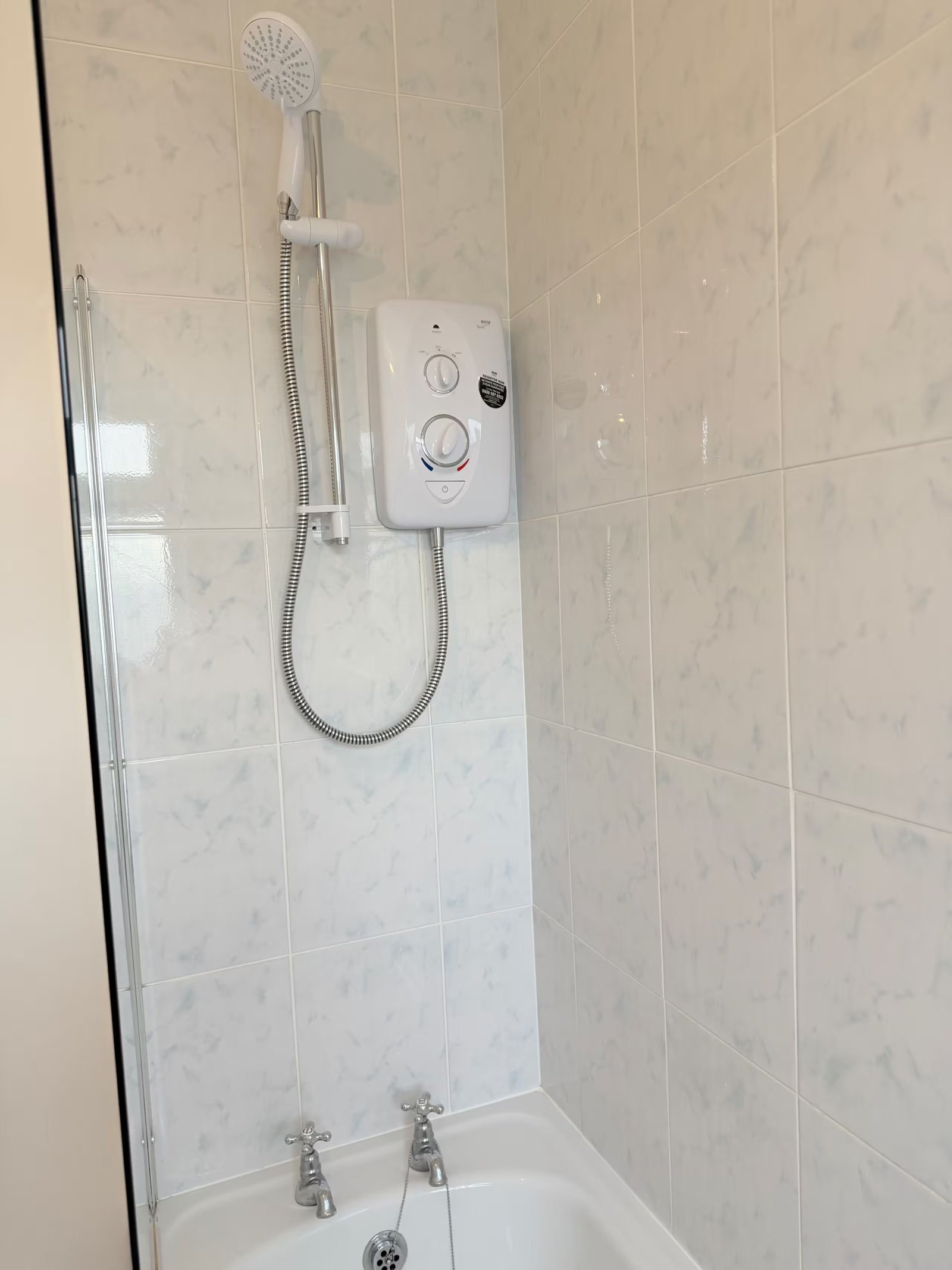Bathroom with bath and shower